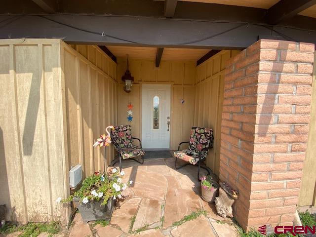 24502 Rd North Cortez, CO 81321 - Photo 5 of 35 a front view of a house with a potted plant