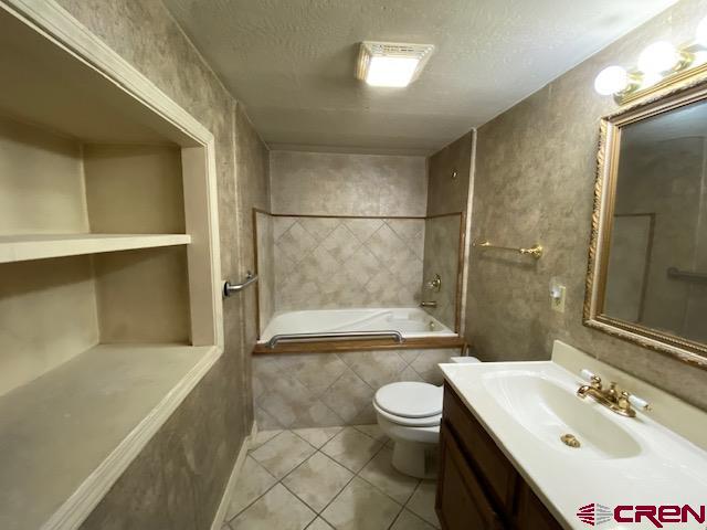 24502 Rd North Cortez, CO 81321 - Photo 10 of 35 a bathroom with a sink toilet and shower