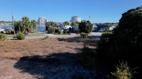 a view of a house with yard and sitting area