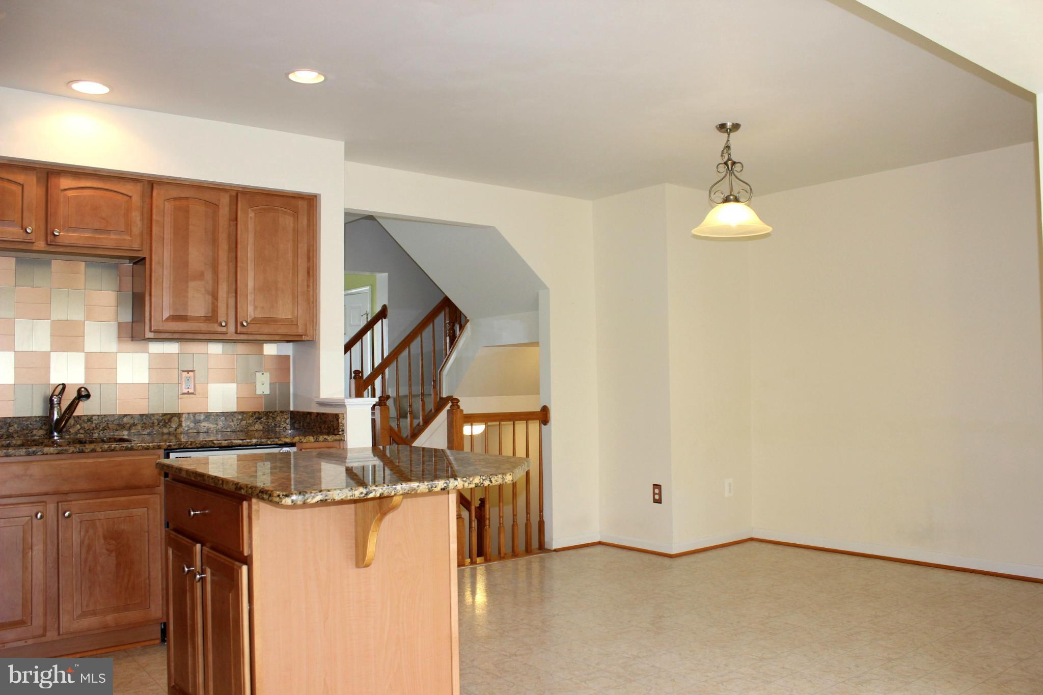 1319 Steed Street Ranson, WV 25438 - Photo 13 of 22 a kitchen that has a lot of cabinets in it
