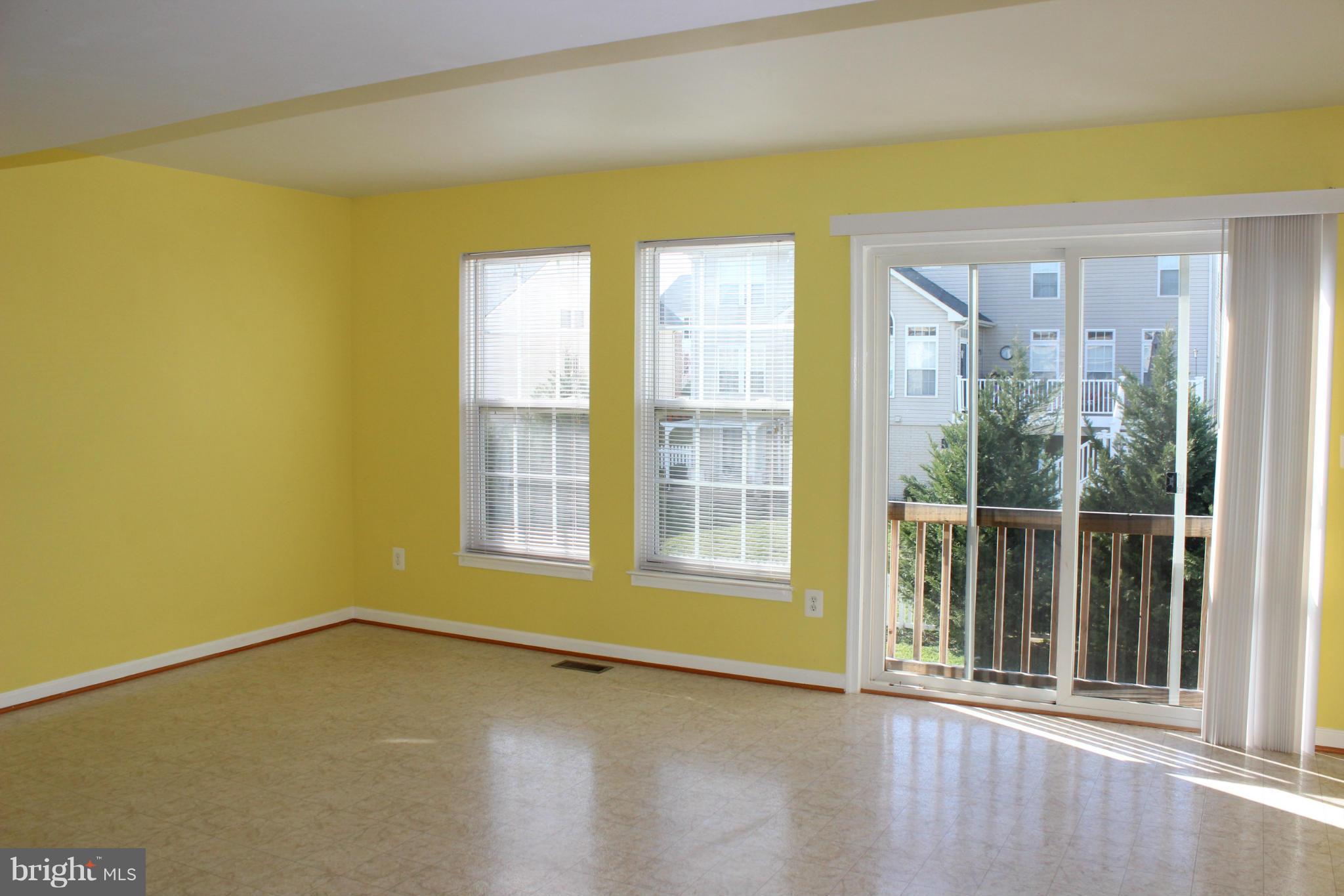 1319 Steed Street Ranson, WV 25438 - Photo 16 of 22 a view of an empty room with a window and wooden floor
