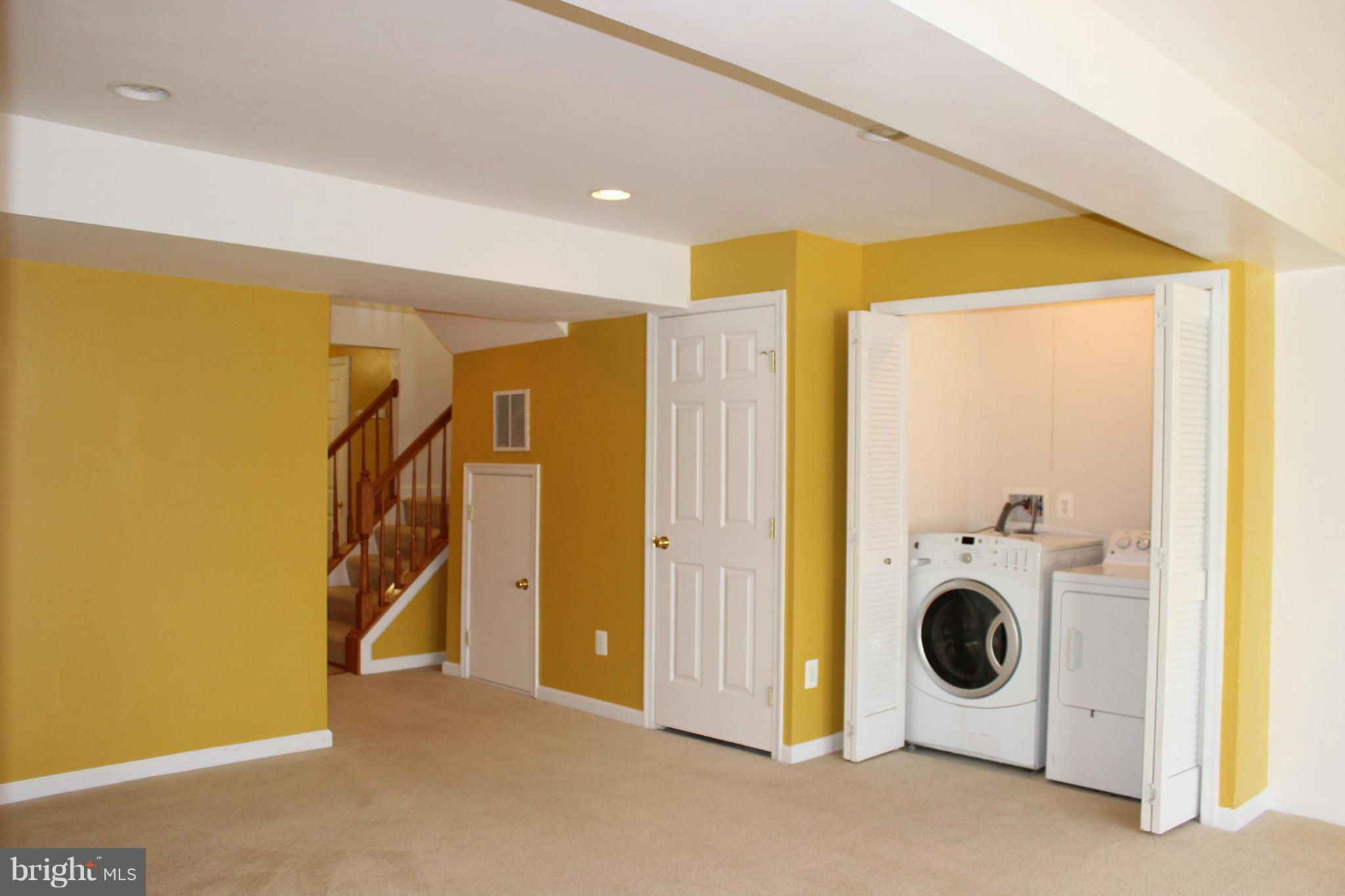 1319 Steed Street Ranson, WV 25438 - Photo 4 of 22 a view of a hallway with washer and dryer