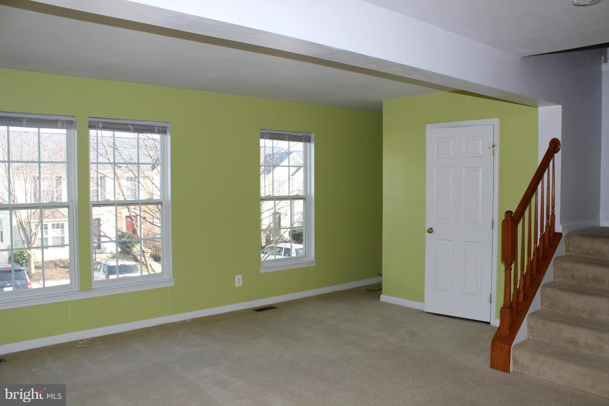 1319 Steed Street Ranson, WV 25438 - Photo 9 of 22 a view of an empty room with windows & cabinet