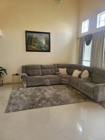 a living room with furniture and a couch