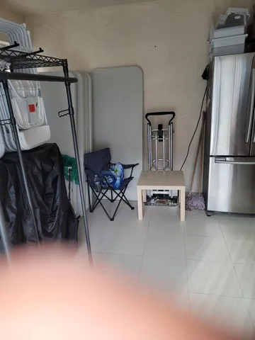 a view of kitchen with furniture and cabinets