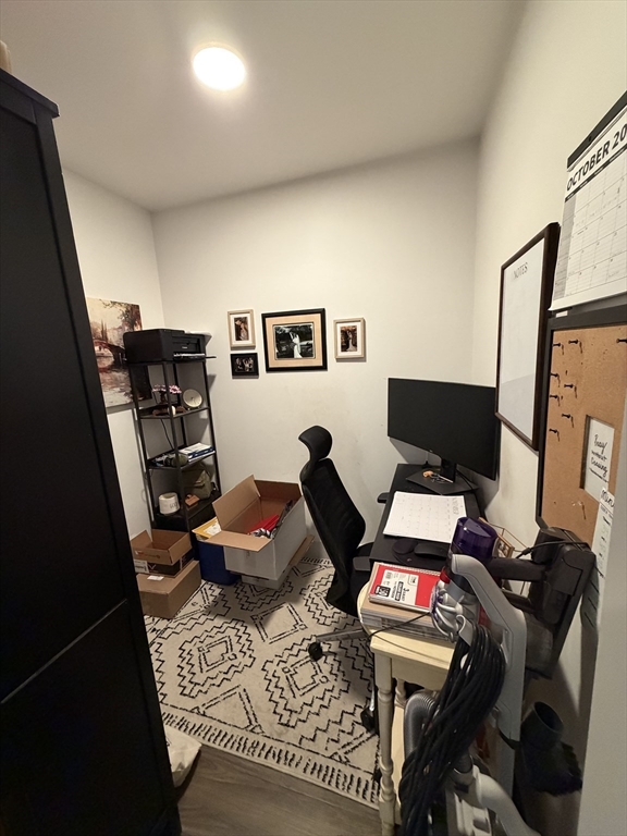 5 West Dane Street, Unit 7 Beverly, MA 01915 - Photo 4 of 14 a workspace with furniture and rug