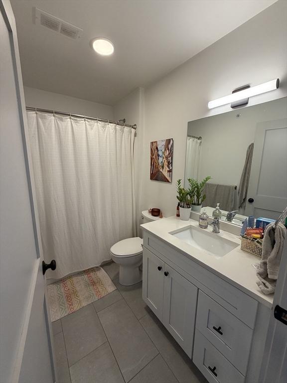 5 West Dane Street, Unit 7 Beverly, MA 01915 - Photo 5 of 14 a bathroom with a double vanity sink and a mirror