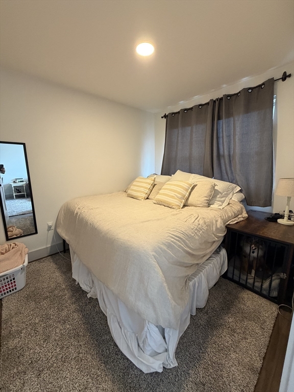 5 West Dane Street, Unit 7 Beverly, MA 01915 - Photo 6 of 14 a bedroom with a bed and lamp