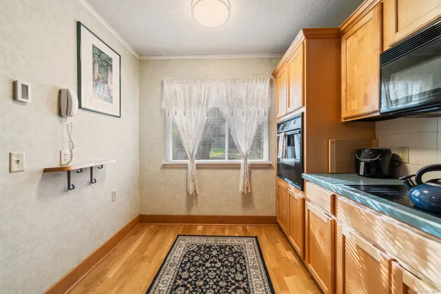 a view of a kitchen with a sink and dishwasher