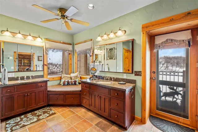 a kitchen with a stove a sink and cabinets
