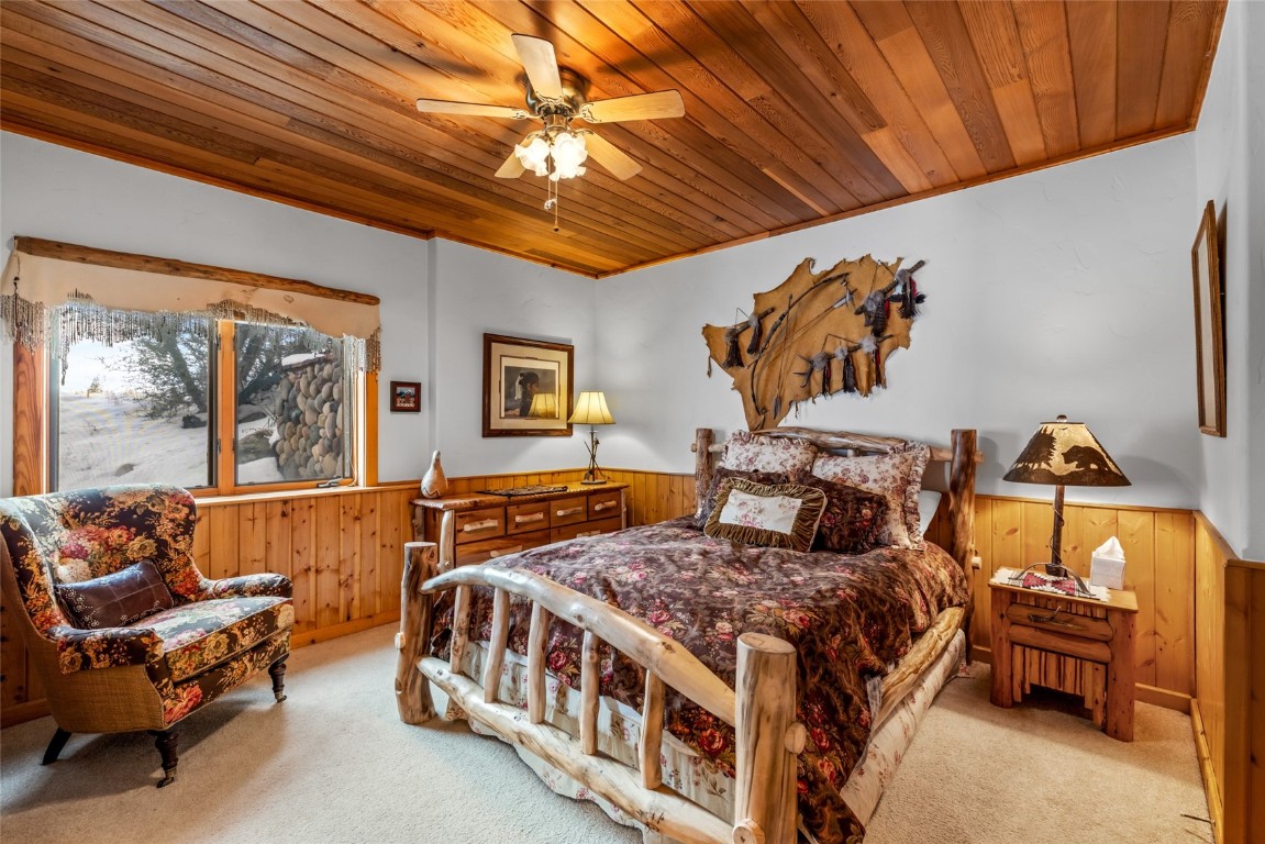 32790 Hidden Pond Path Steamboat Springs, CO 80487 - Photo 22 of 31 a bedroom with double bed and a couch