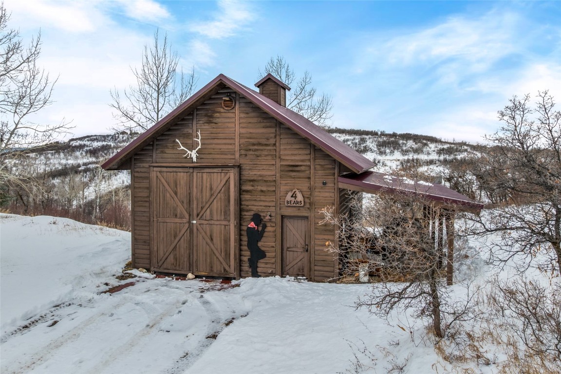 32790 Hidden Pond Path Steamboat Springs, CO 80487 - Photo 26 of 31 a view of a wooden house with a large space