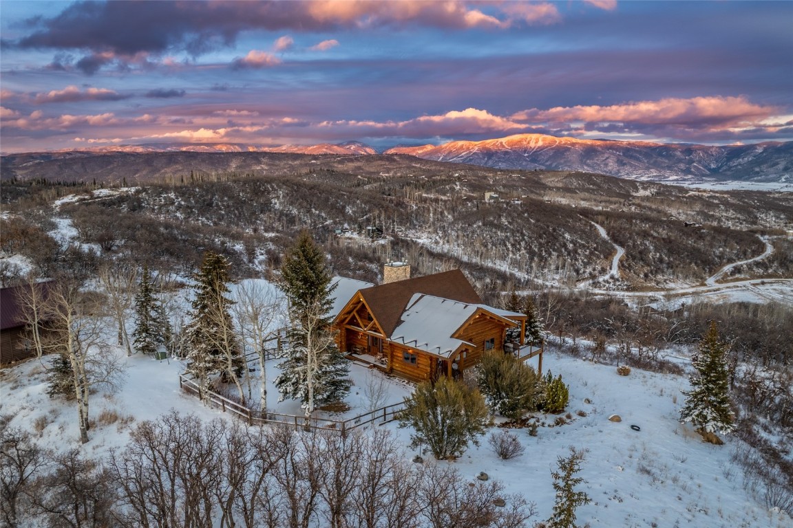 32790 Hidden Pond Path Steamboat Springs, CO 80487 - Photo 3 of 31 an aerial view of a house with a yard