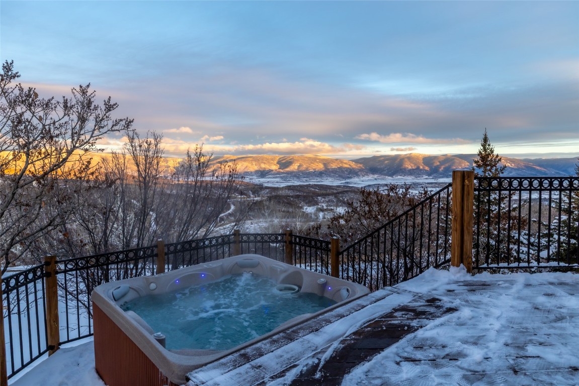 32790 Hidden Pond Path Steamboat Springs, CO 80487 - Photo 8 of 31 a view of roof deck with a barbeque and wooden stairs