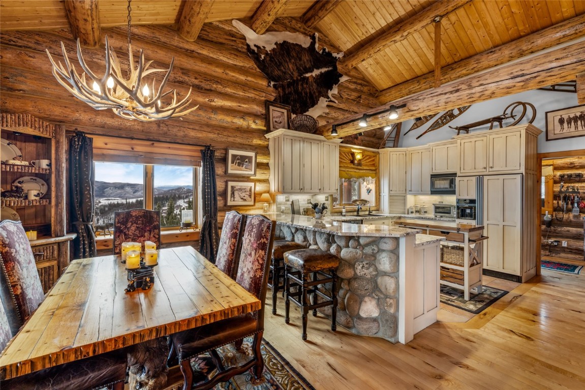 32790 Hidden Pond Path Steamboat Springs, CO 80487 - Photo 9 of 31 a view of a dining hall with furniture and wooden floor