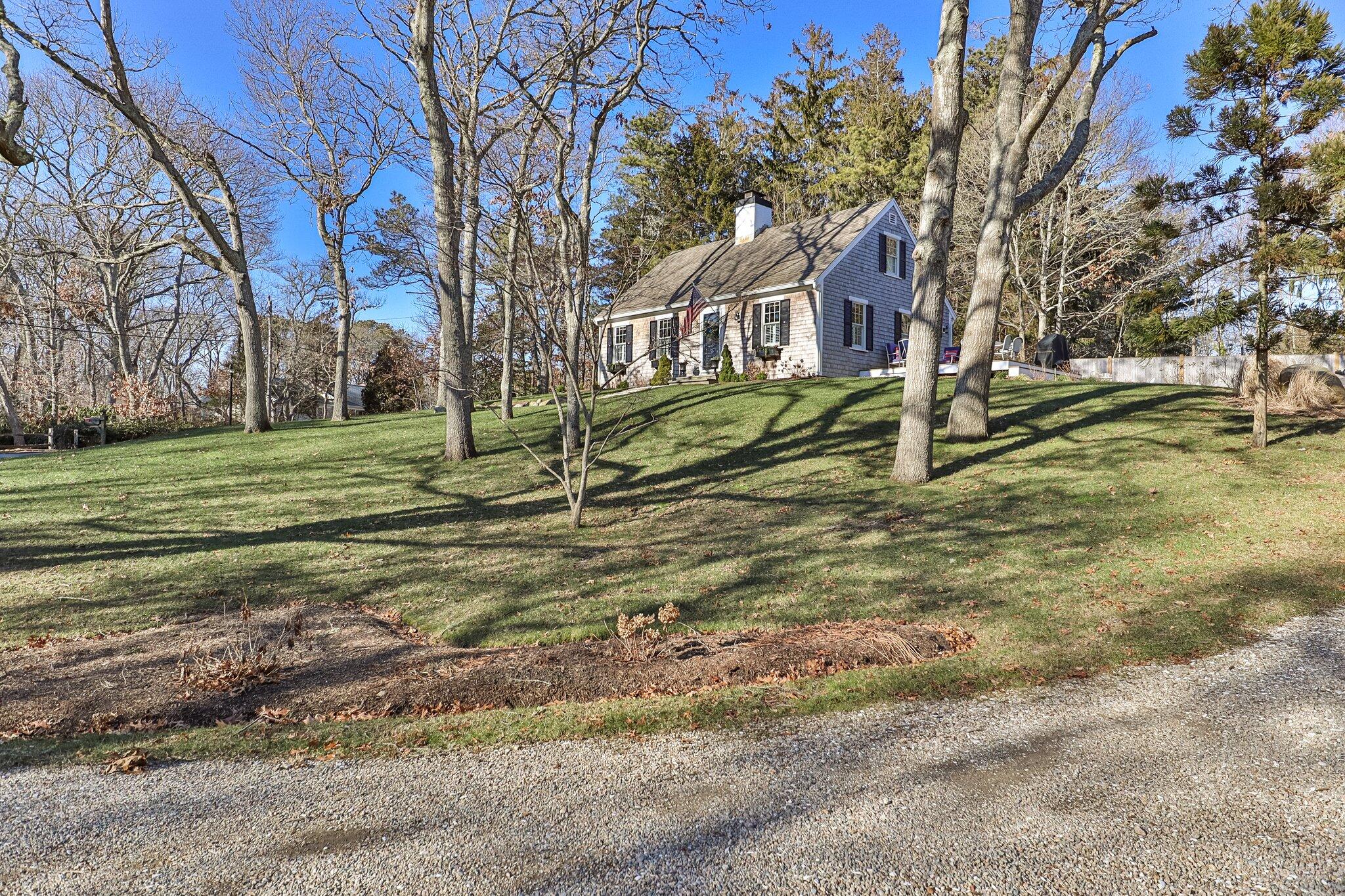 76 Headwaters Road Centerville, MA 02632 - Photo 39 of 53 a view of a house with a yard