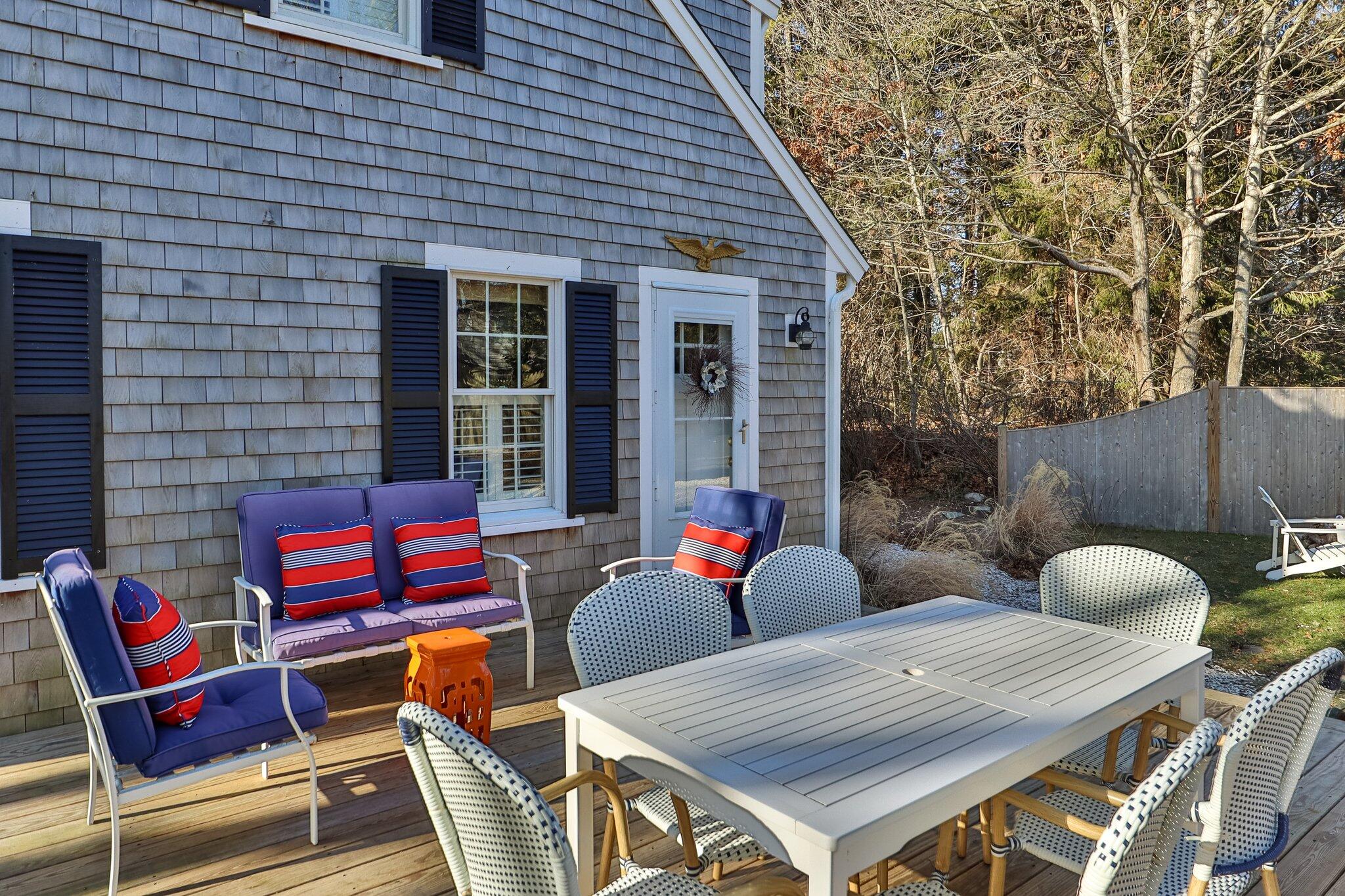 76 Headwaters Road Centerville, MA 02632 - Photo 47 of 53 a outdoor space with patio the couches and a potted plant on a table