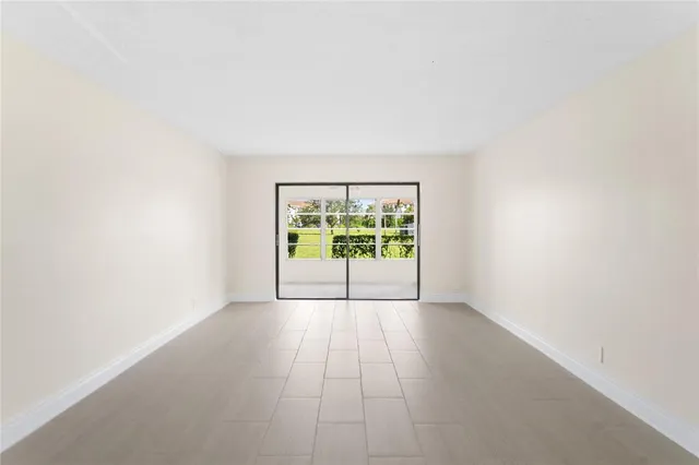 a view of a patio with a yard