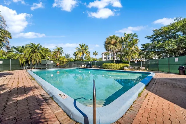 a view of a pool with a yard