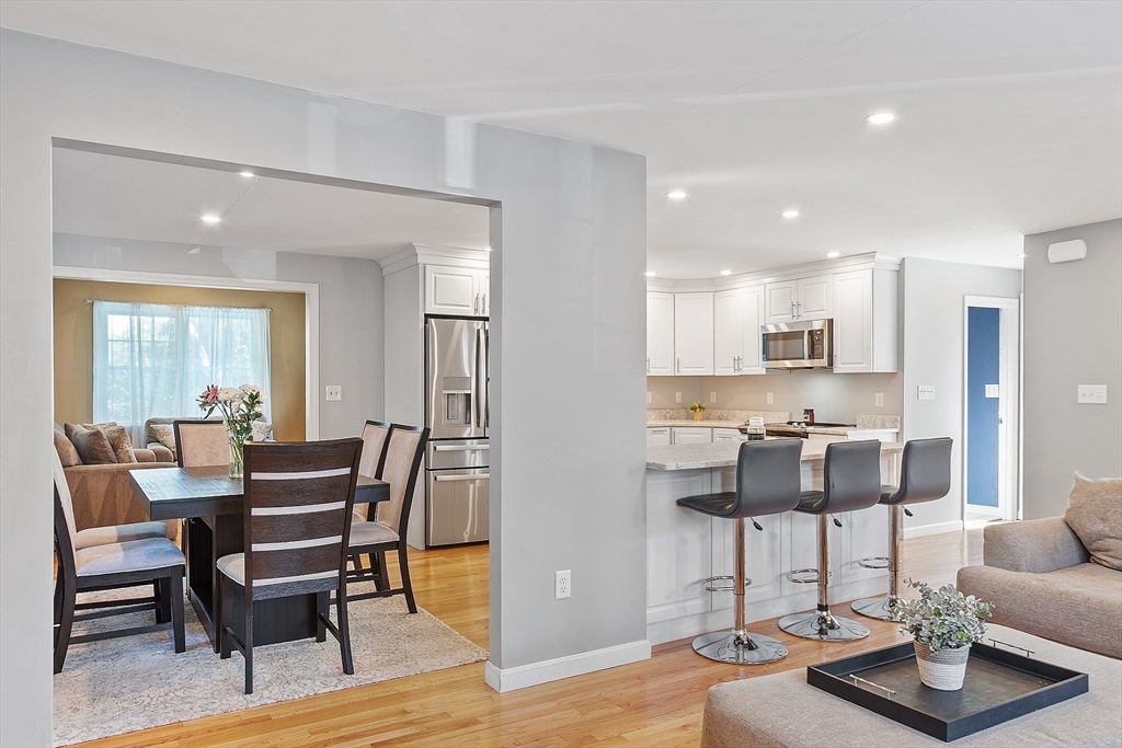 145 Virginia Road Waltham, MA 02453 - Photo 13 of 36 a view of a dining room with furniture and wooden floor