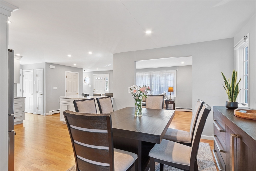 145 Virginia Road Waltham, MA 02453 - Photo 15 of 36 a view of a dining room with furniture and wooden floor