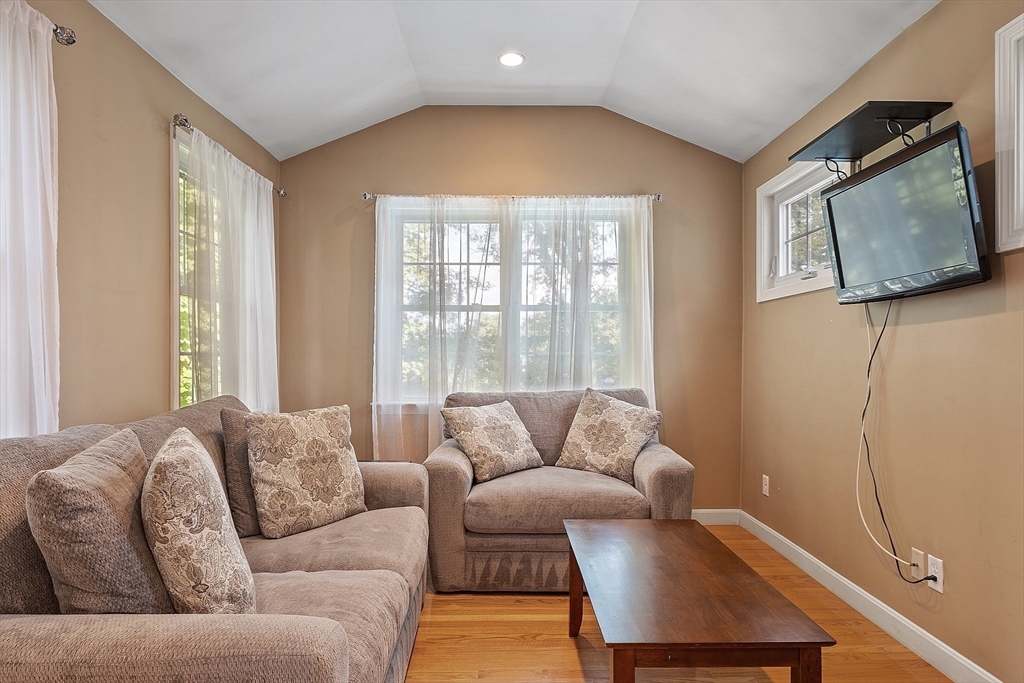 145 Virginia Road Waltham, MA 02453 - Photo 17 of 36 a living room with furniture and a window