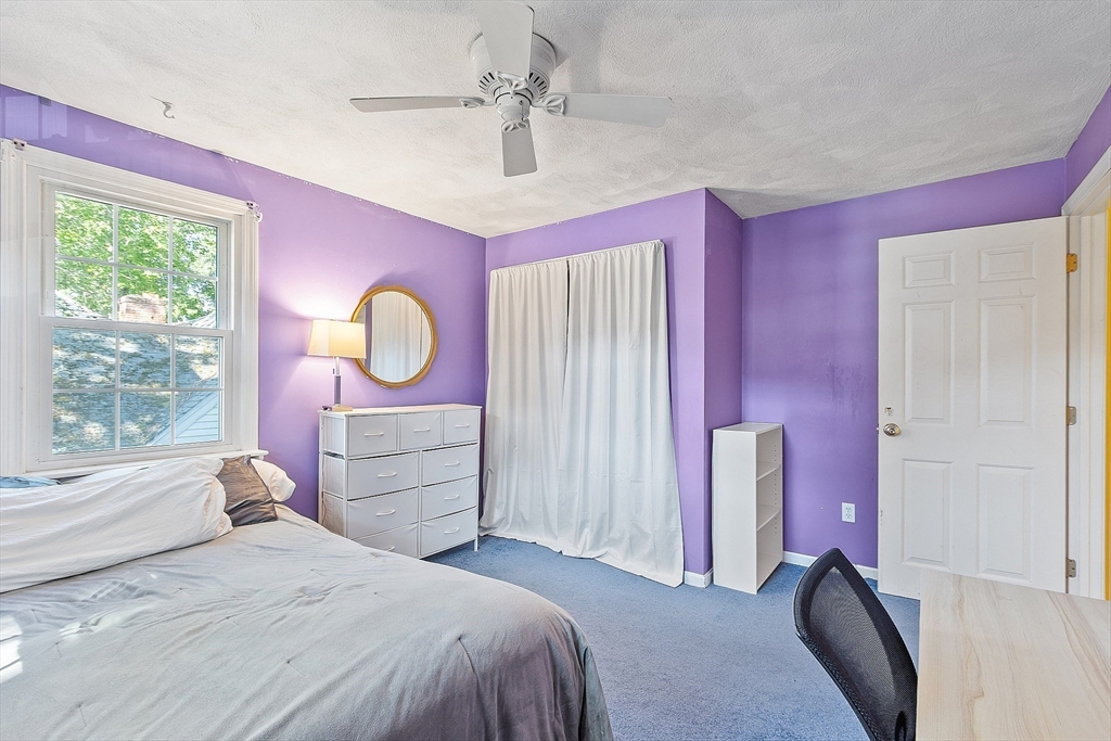 145 Virginia Road Waltham, MA 02453 - Photo 20 of 36 a bedroom with a bed dresser and a window