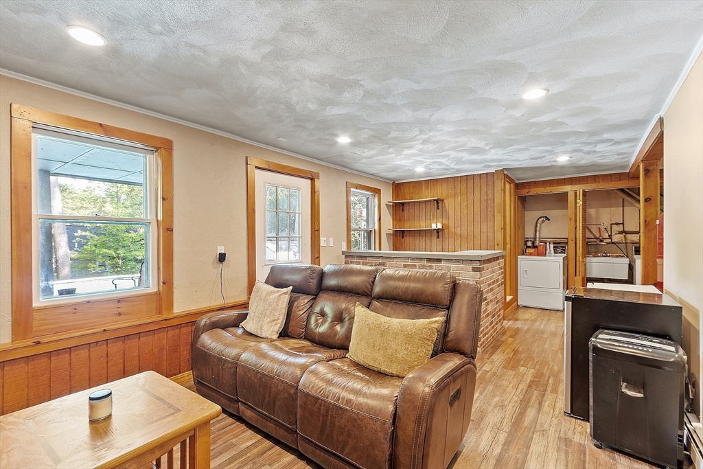 145 Virginia Road Waltham, MA 02453 - Photo 23 of 36 a living room with furniture and a window
