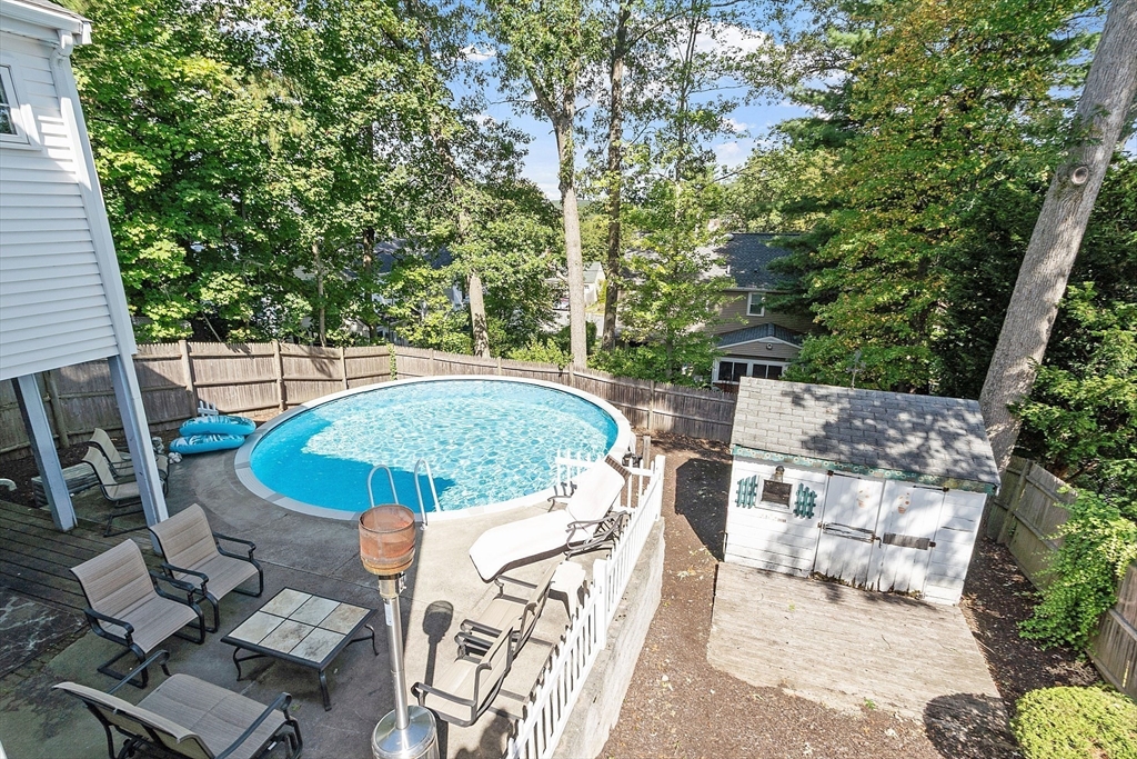 145 Virginia Road Waltham, MA 02453 - Photo 27 of 36 a view of a swimming pool with a patio