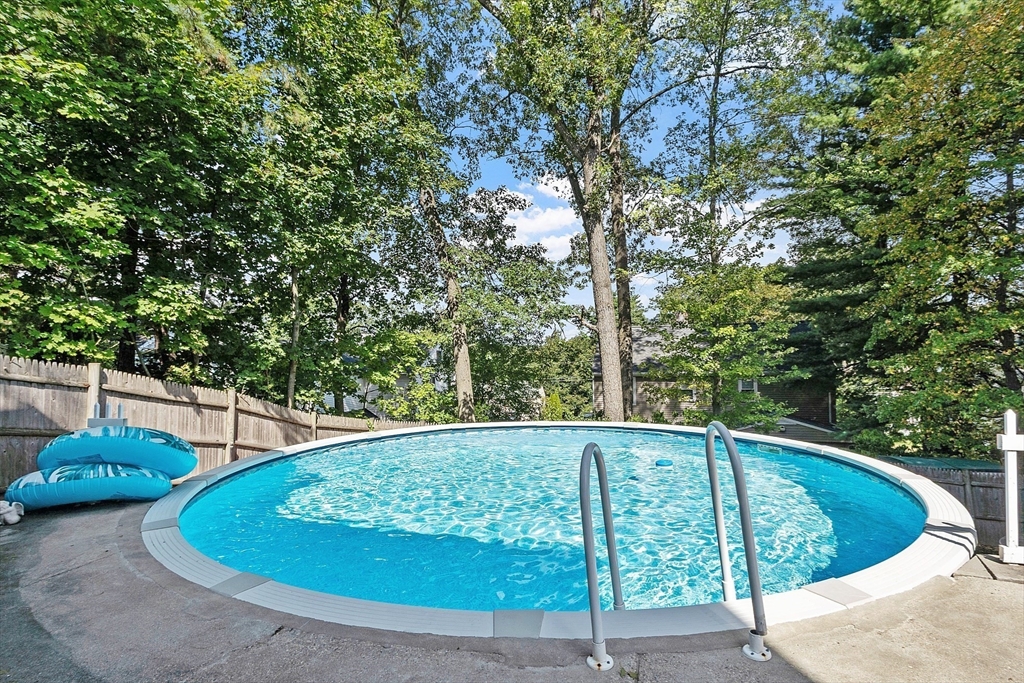 145 Virginia Road Waltham, MA 02453 - Photo 28 of 36 a view of a swimming pool with a patio