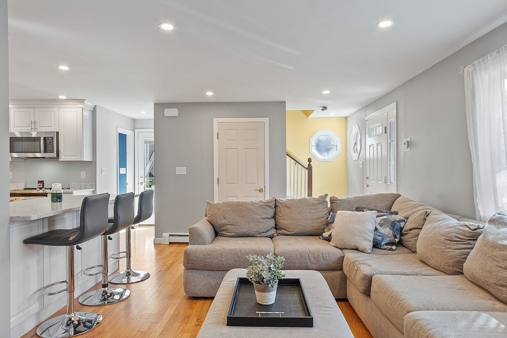 145 Virginia Road Waltham, MA 02453 - Photo 9 of 36 a living room with furniture and a large window