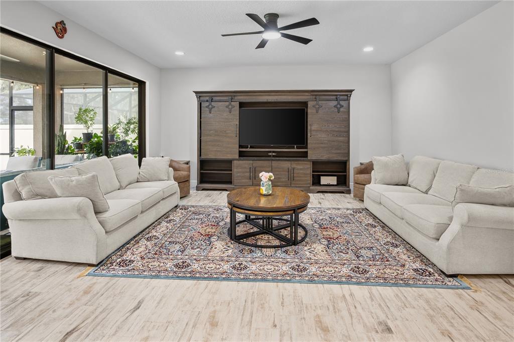 14654 Horse Trot Road Lithia, FL 33547 - Photo 11 of 53 a living room with furniture and a flat screen tv