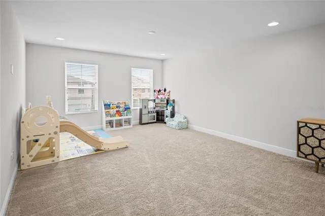 a bedroom with a bed and a desk