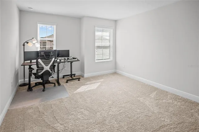 a bedroom with a bed and a mirror