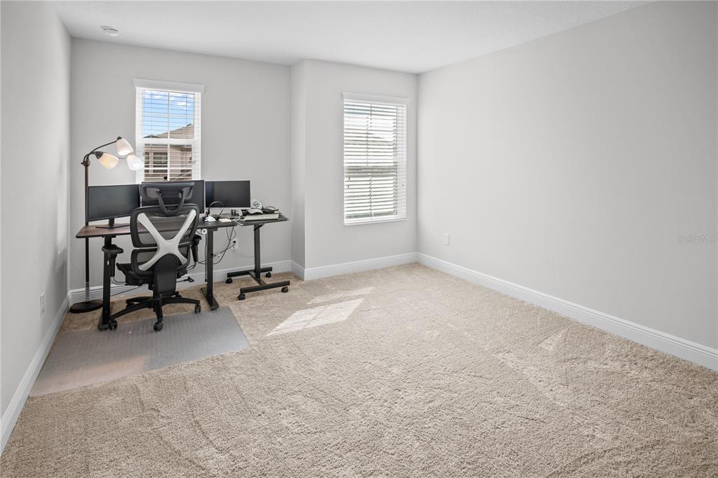 14654 Horse Trot Road Lithia, FL 33547 - Photo 22 of 53 a view of a workspace with furniture and a window