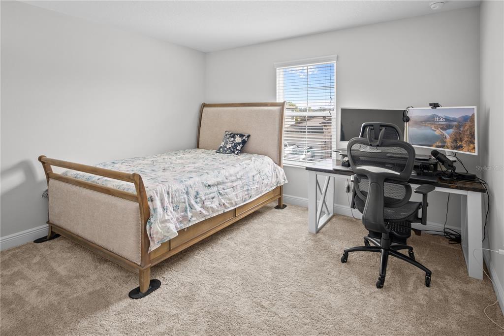 14654 Horse Trot Road Lithia, FL 33547 - Photo 24 of 53 a bedroom with a bed and a desk