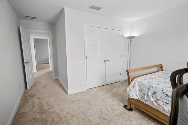 a bathroom with a double vanity sink window and a mirror