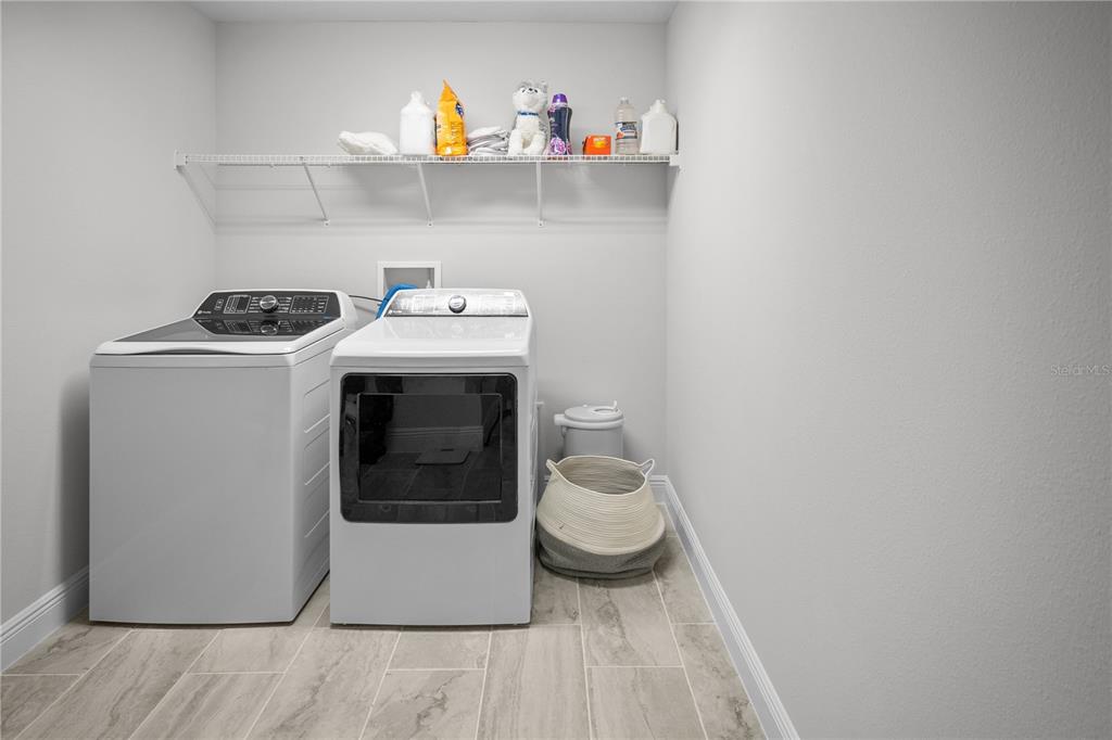 14654 Horse Trot Road Lithia, FL 33547 - Photo 34 of 53 a utility room with dryer and washer