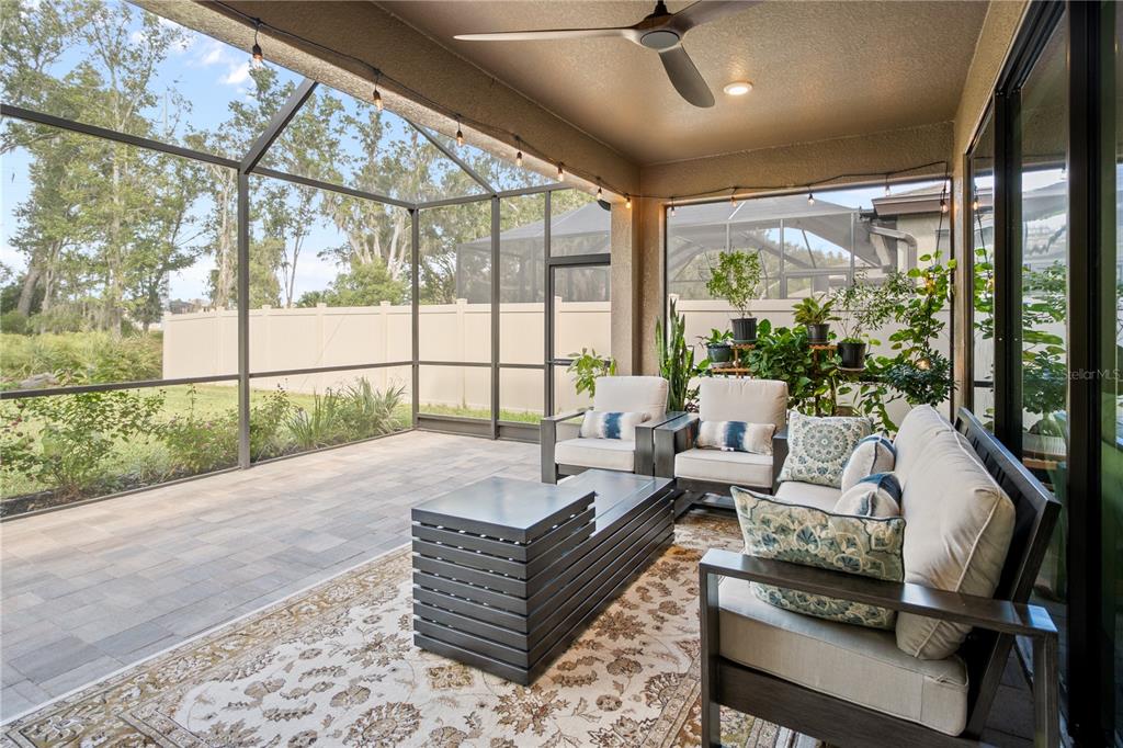 14654 Horse Trot Road Lithia, FL 33547 - Photo 35 of 53 a living room with furniture and a floor to ceiling window