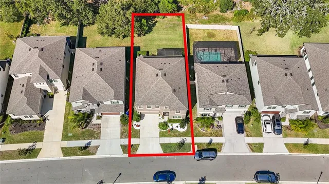 an aerial view of residential house with outdoor space