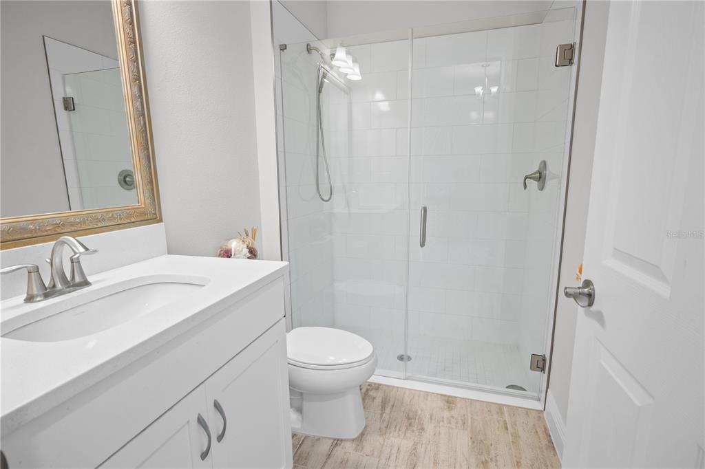 14654 Horse Trot Road Lithia, FL 33547 - Photo 5 of 53 a bathroom with a sink a toilet and shower