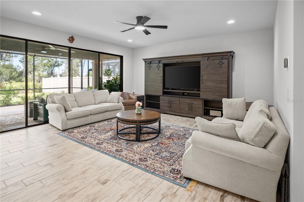 14654 Horse Trot Road Lithia, FL 33547 - Photo 9 of 53 a living room with furniture and a flat screen tv