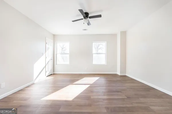 a view of an empty room with a window
