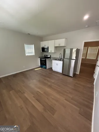 a view of a kitchen with a sink