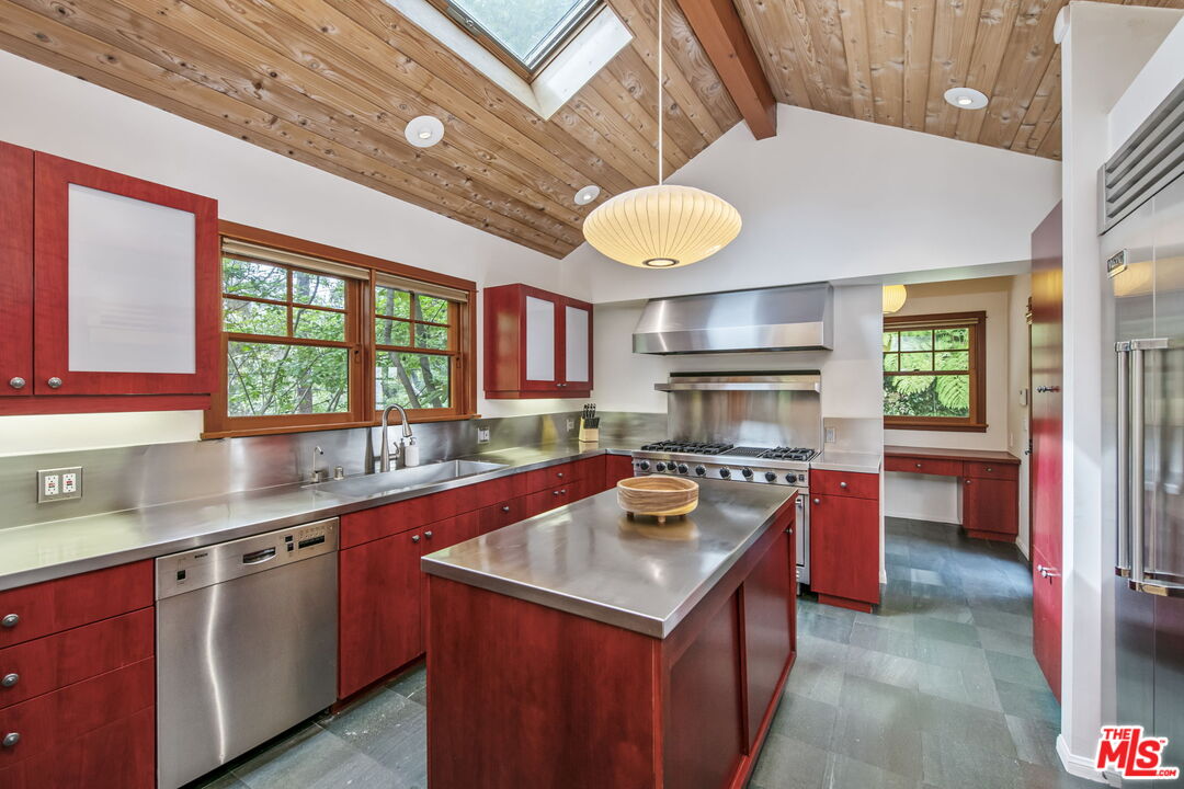27 Latimer Road Santa Monica, CA 90402 - Photo 12 of 37 a kitchen with a stove window and cabinets