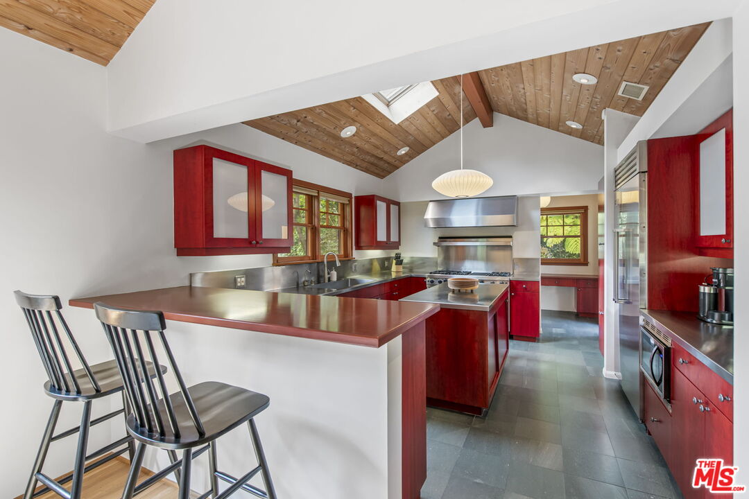 27 Latimer Road Santa Monica, CA 90402 - Photo 13 of 37 a kitchen with cabinets a sink and appliances