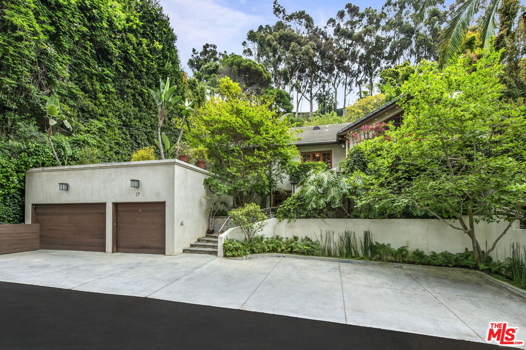 27 Latimer Road Santa Monica, CA 90402 - Photo 2 of 37 a front view of a house with a yard and garage
