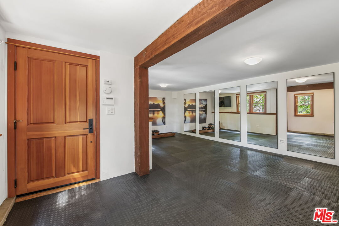27 Latimer Road Santa Monica, CA 90402 - Photo 24 of 37 an empty room with wooden floor and windows