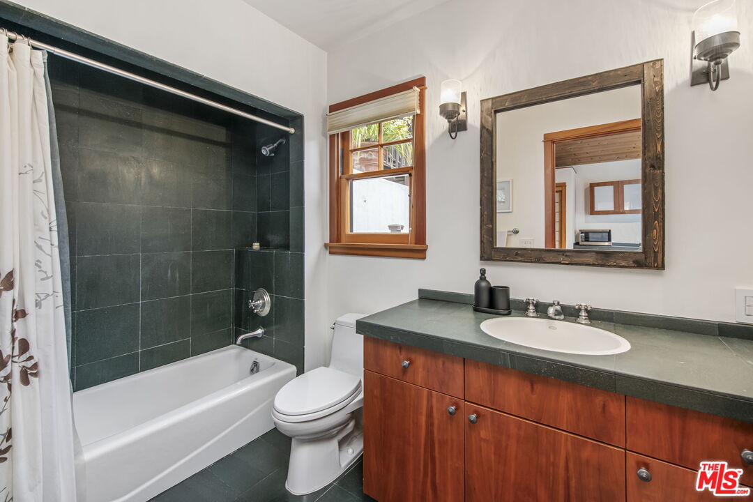 27 Latimer Road Santa Monica, CA 90402 - Photo 32 of 37 a bathroom with a sink a toilet and shower