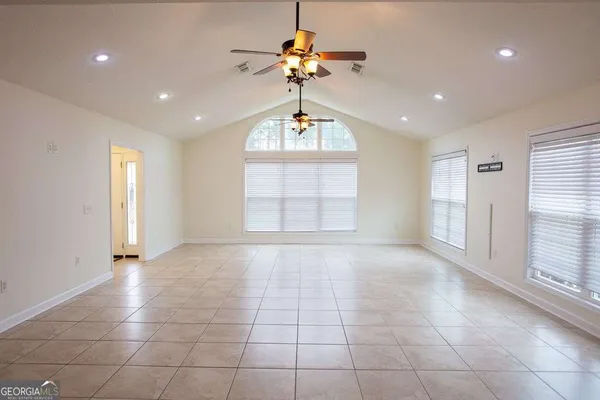 a view of an empty room with a window